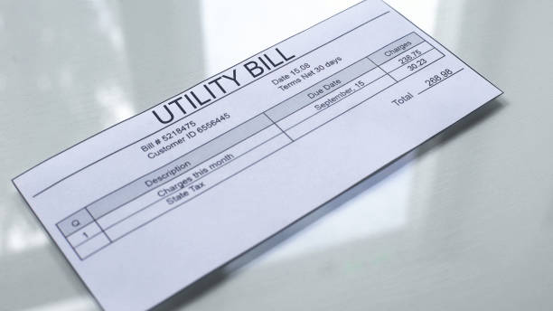 Utility bill lying on table, payment for services, month expenses, tariff Utility bill lying on table, payment for services, month expenses, tariff invoice pad stock pictures, royalty-free photos & images