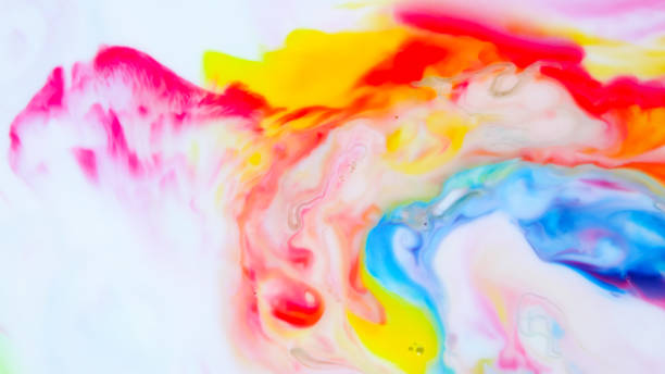 istock Multicolored background from paints on liquid. Fluid art with different colors. Screen saver. Bright pattern on liquid. Colored paint stains in pop art style 1144432915