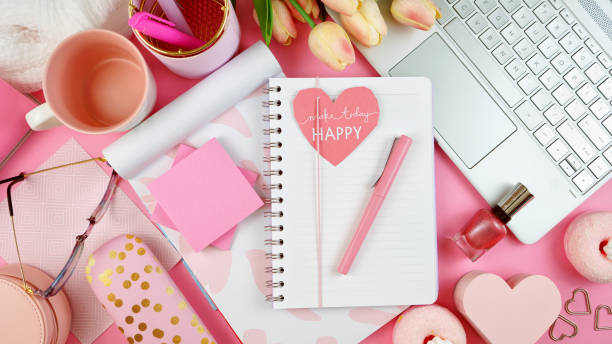istock Ultra feminine workspace with touch screen PC overhead flat lay. 1144435099