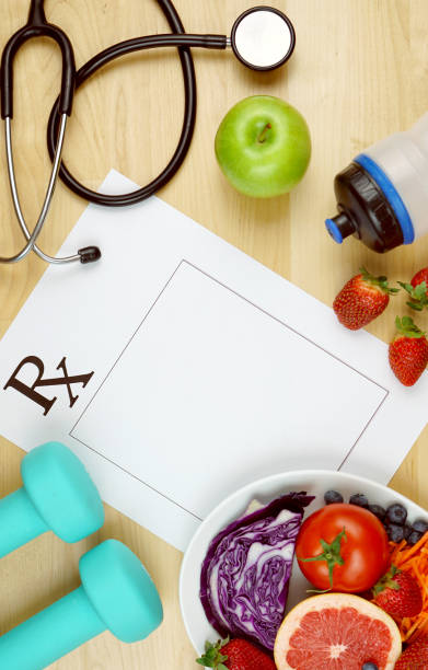 istock Prescription for good health diet and exercise flat lay overhead with copyspace. 1144435802