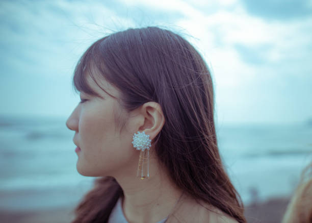 istock Side view of young woman wearing earring 1144438201