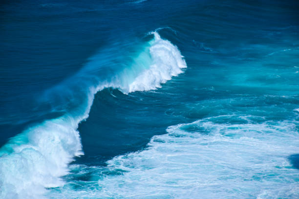 istock Splashing waves near the coastline 1144438825