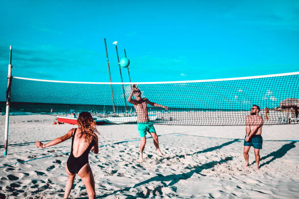 istock Friends Playing Beach Volleyball 1144439061