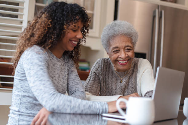 istock Senior woman learning how to use a laptop 1144444293