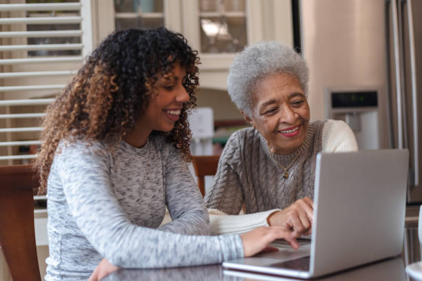istock Senior woman learning how to use a laptop 1144444302