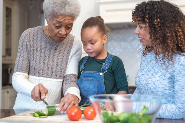 istock Family generations cooking together 1144444317