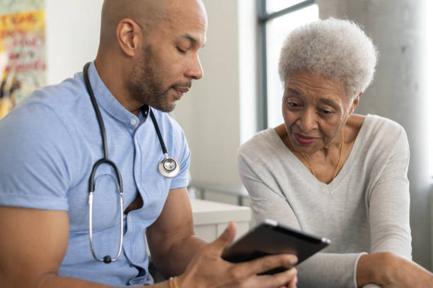 istock Doctor showing his patient their results 1144444427