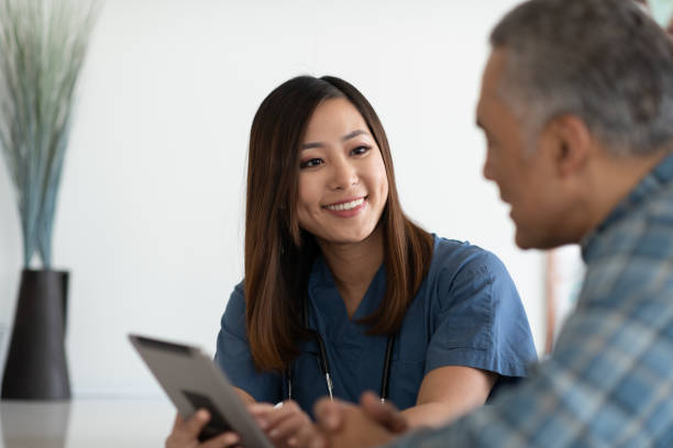istock Young doctor with elderly patient 1144444461