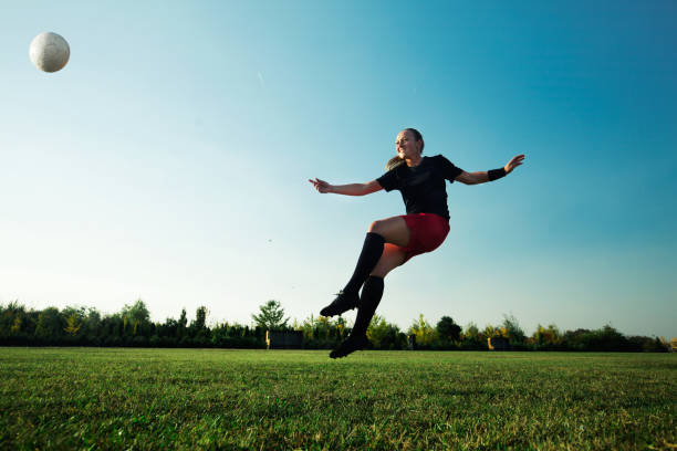 istock Female soccer player shoot the ball 1144447239
