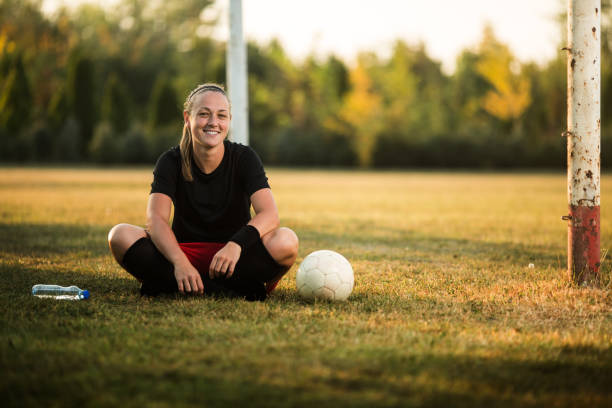 istock Female soccer player resting 1144447616