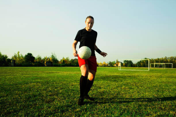 istock Female soccer player shoot the ball 1144447792