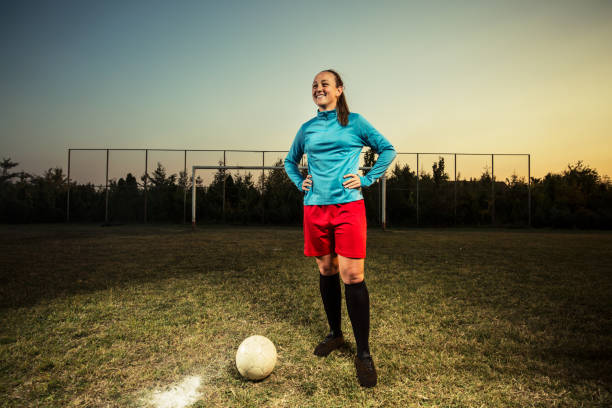 istock Young woman playing soccer 1144448663