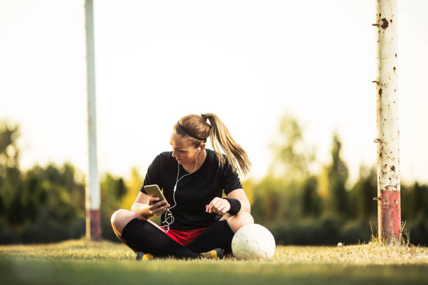 istock Young female soccer player resting after her training 1144449441