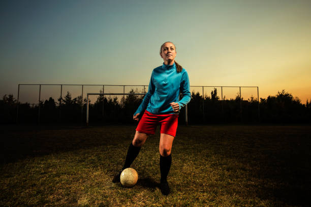 istock Beautiful young female soccer player 1144449793