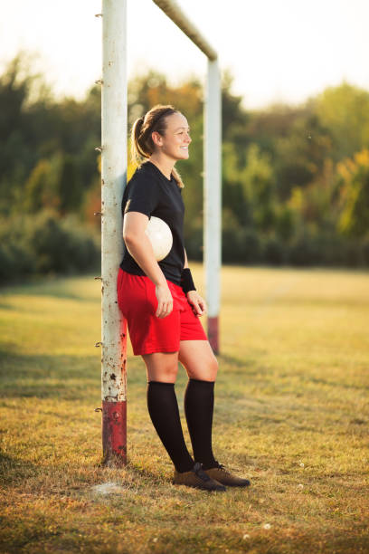 istock Female soccer player resting 1144449796