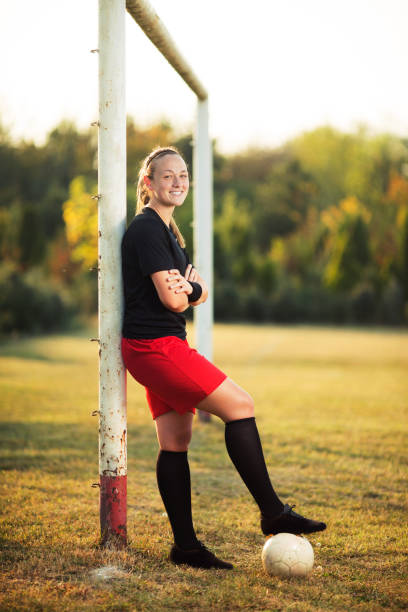 istock Female soccer player resting 1144450706