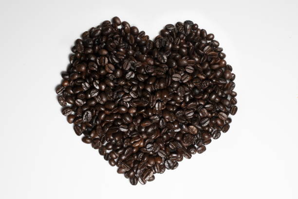 istock Coffee Grains Heart Shape Isolated on White Background 1144455414