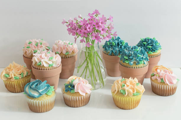 istock Assorted Garden Party Cupcakes in Terracotta Pots 1144456350