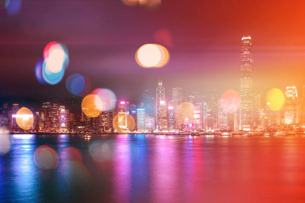 istock Abstract colorful circular bokeh with city background. Double exposure 1144456507