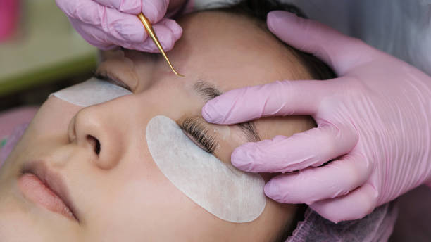 istock Eyelash Extension Procedure. Woman Eye with Long Eyelashes 1144457534
