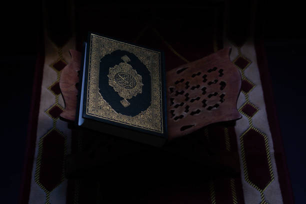 istock Quran placed on a wooden board 1144466401