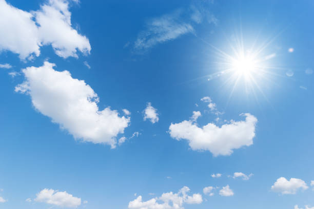 istock Blue sky background with the sun,Blue sky with white clouds floating in the sky. 1144470507
