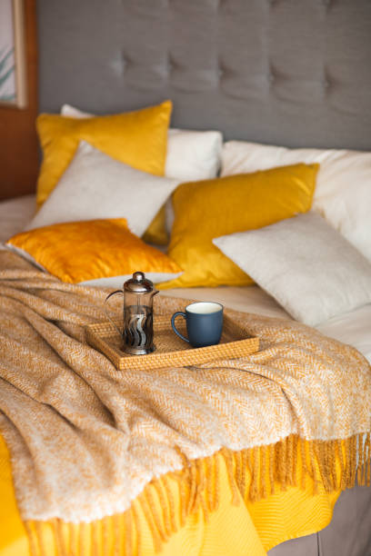 istock Wood tray with tea on orange bed. 1144472600