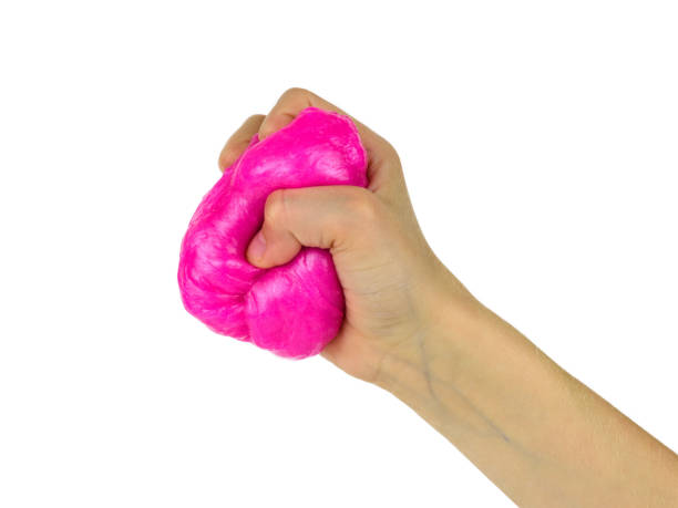 istock Bright red slime in baby's hand isolated on white background. 1144472903
