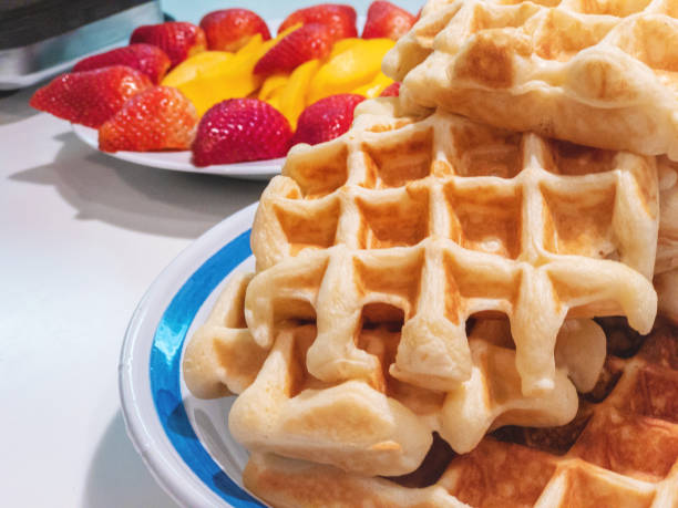 istock Belgian Waffles Strawberries and Mango Breakfast Food 1144473042