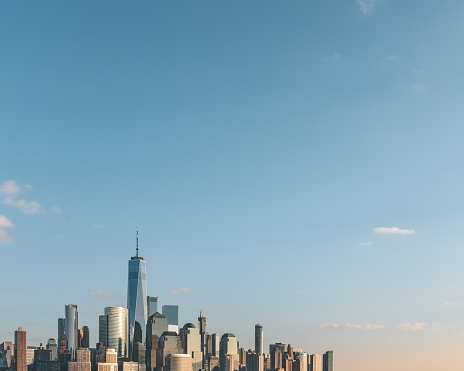 Skyline of downtown  Manhattan of New York City, under blue sky, viewed from New Jersey, USA