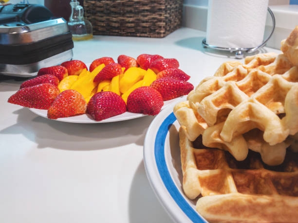 istock Belgian Waffles Strawberries and Mango Breakfast Food 1144475284