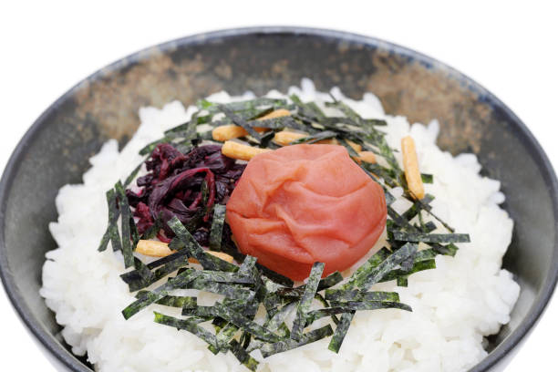 Japanese food, Rice chazuke or ochazuke with umeboshi and shiso, on white background