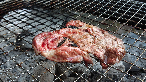 istock bleeding sliced beef grill on the charcoal 1144478490