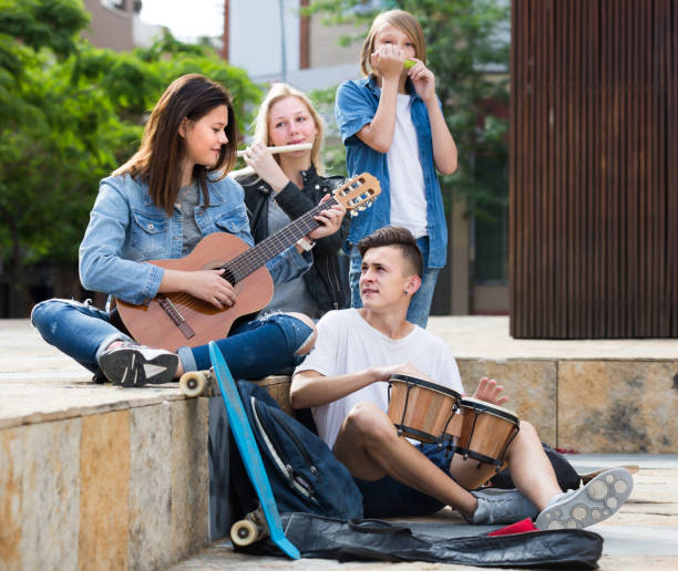 istock Cheerful teenagers with musical instruments 1144485461
