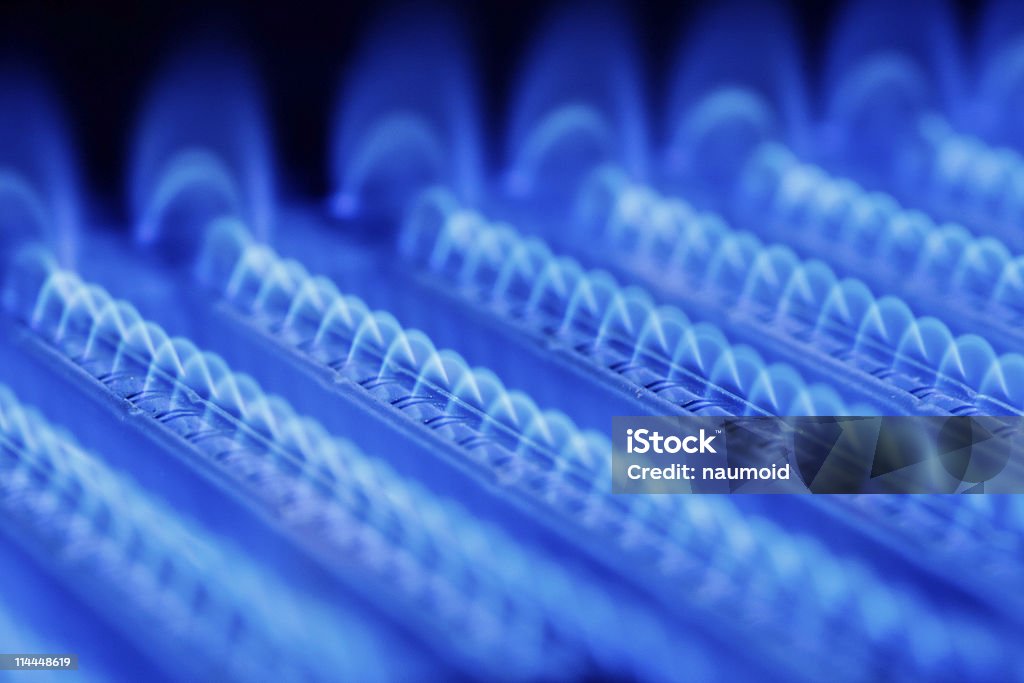 Gas flame Blue flames of a gas burner inside of a boiler Boiler Stock Photo