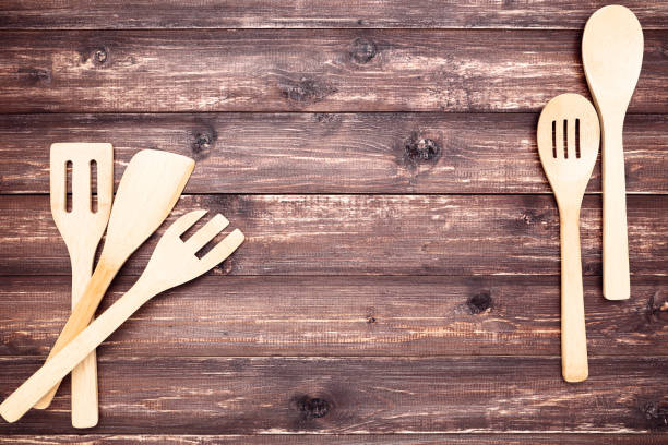 istock Wooden kitchen cutlery on brown table 1144486726