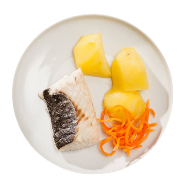 istock Pollock prepared on steam, served with boiled potatoes and carrots 1144486832