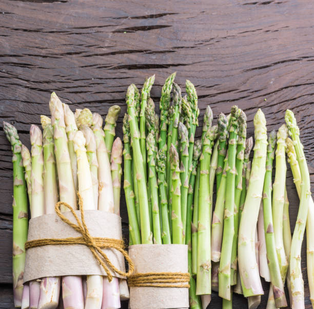 istock Green and white types of asparagus sprouts. 1144488647