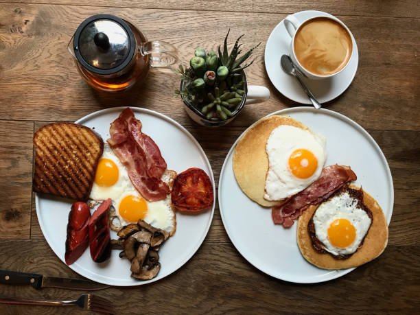 istock Aussie / Australian Breakfast with Brioche Toast, Fried Eggs, Crispy Bacon Sausage, Salty Pancakes and Mushrooms. 1144489309