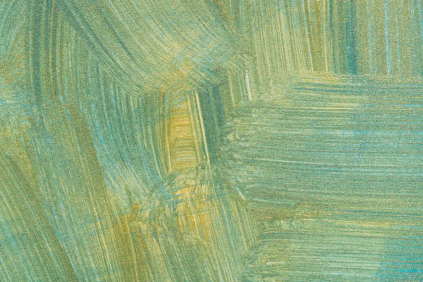 istock gold and green painted on paper background texture 1144489352