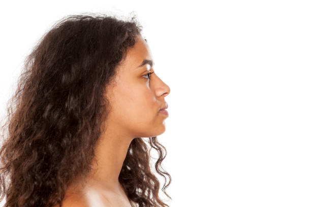 istock profile of a serious young dark-skinned woman without makeup on a white background 1144489468