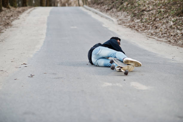 istock Street style arab man in eyeglasses with longboard 1144489855