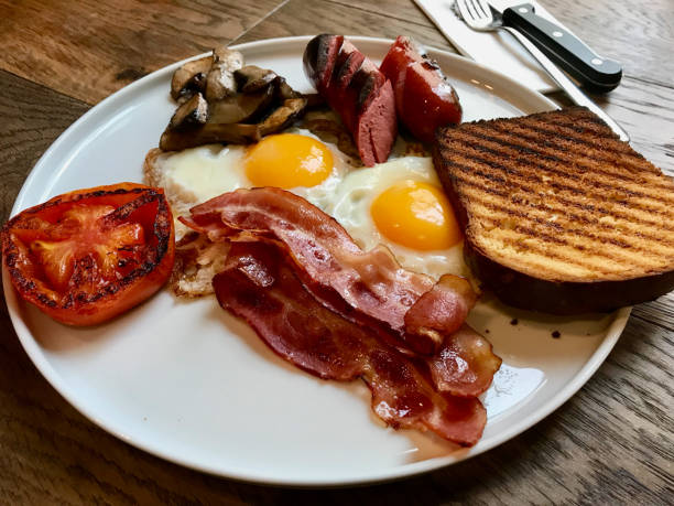 istock Aussie / Australian Breakfast with Brioche Toast, Fried Eggs, Crispy Bacon Sausage, Salty Pancakes and Mushrooms. 1144491326