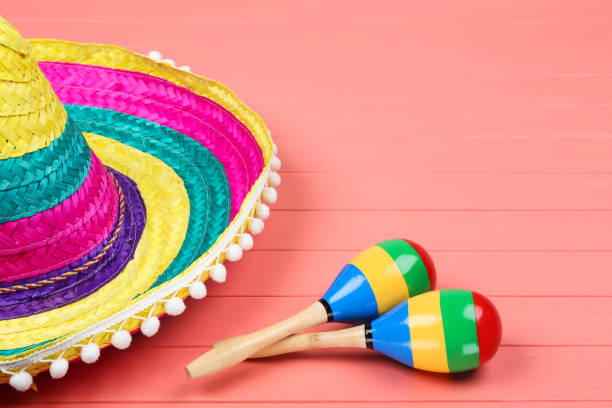 istock Mexican hat and maracas on wooden table 1144492605