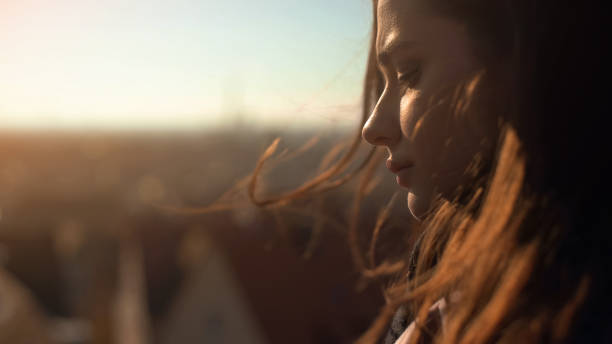 istock Lonely pensive young lady standing on skydeck, upset wit personal troubles 1144494228