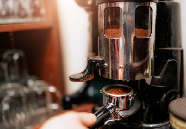 istock Fresh coffee in portafilter ground by the coffee grinder 1144494763