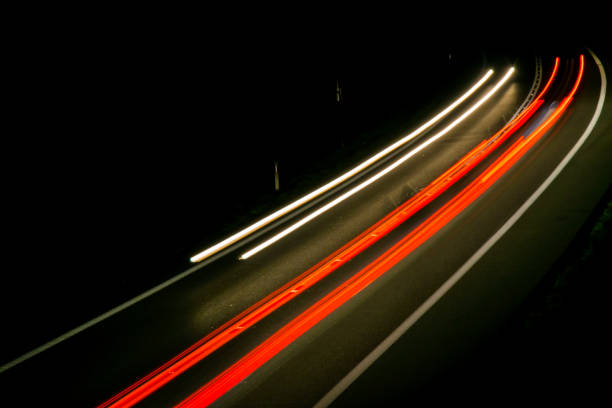 istock lights of cars with night 1144495520