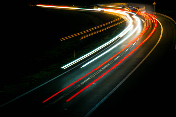 istock lights of cars with night 1144495521