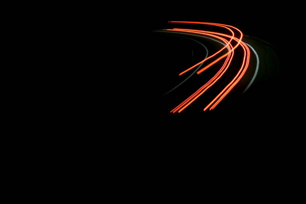 istock lights of cars with night 1144495604