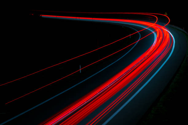 istock lights of cars with night 1144495698